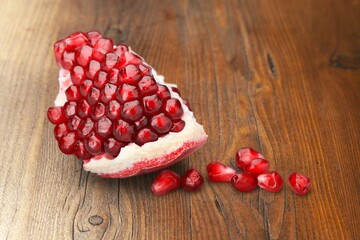 Fresh tasty ripe pomegranate on desk