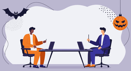 Two diverse businessmen collaborate at a festive Halloween-themed office, working on laptops. Ideal for seasonal business, team meetings, or holiday promotions.