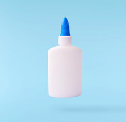 Back to school conception. Flying in the air school equipment. A PVA glue bottle levitating in the...