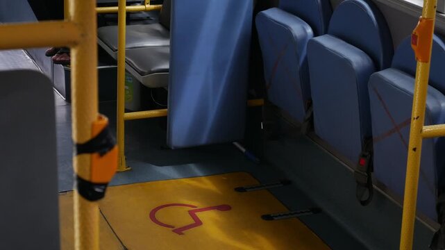 Wheelchair accessible space and designated area for disabled passengers on public transportation bus or train - barrier-free inclusive transit design.