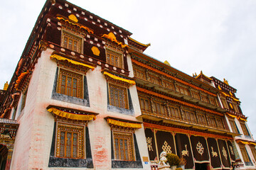Fototapeta premium Intricate, vibrant Tibetan monastery architecture Sangpi Monastery, Xiangcheng, Sichuan