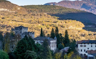 Hidden among autumn’s golden canopy, the ancient tower watches silently over the valley—its...