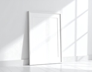 Obraz premium Empty white picture frame in a bright room