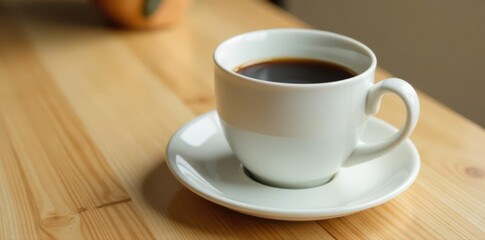 Obraz premium Full ceramic coffee cup, half-full, sits on clean, light oak desk, workspace, half-full