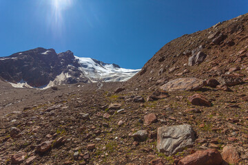 Panorama of the Barba d'Orso glacier with melting stream and 1850 age moraines Vallelunga, Alto Adige - Sudtirol, Italy. Popular mountain for climbers