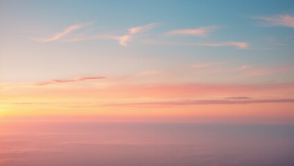 Sunset sky with soft pink and blue clouds over the horizon. Peaceful scene, beautiful sky colors.