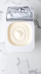 Creamy White Yogurt in Plastic Cup Top View.