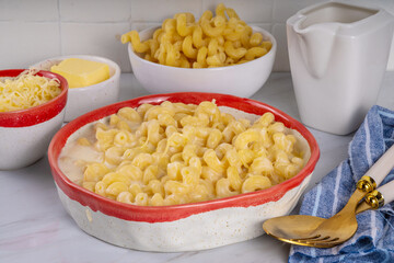 Creamy mac and cheese with ingredients for cooking