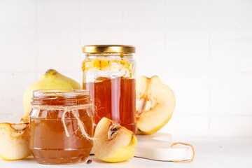 Golden homemade apple quince jam marmalade in small jar