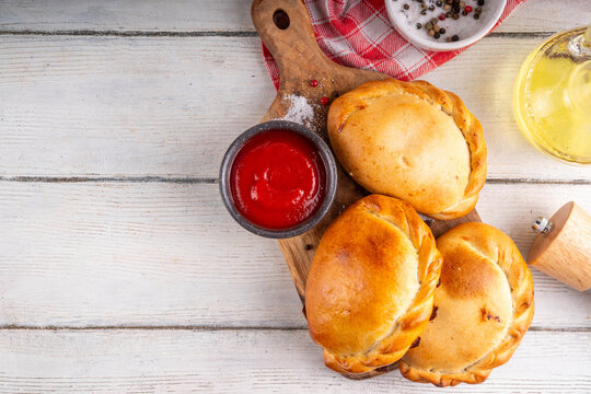 Homemade golden baked hand pies, with meat filling