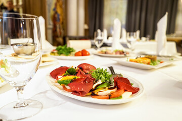 variety of dishes on served tables in a palace-style restaurant