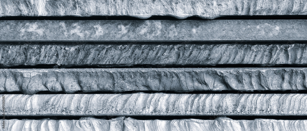 Poster stack of thick heavy metal plates rusty uneven surface after laser cutting. plates stacked top each 