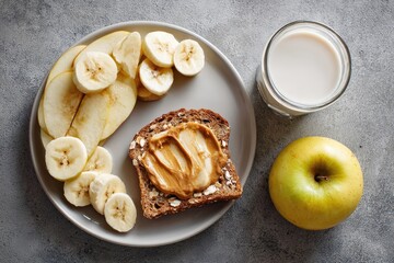 Healthy breakfast with sliced apples, bananas, peanut butter, and milk