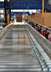 logistic warehouse. packing line in a logistics warehouse. conveyor belt in a modern production line