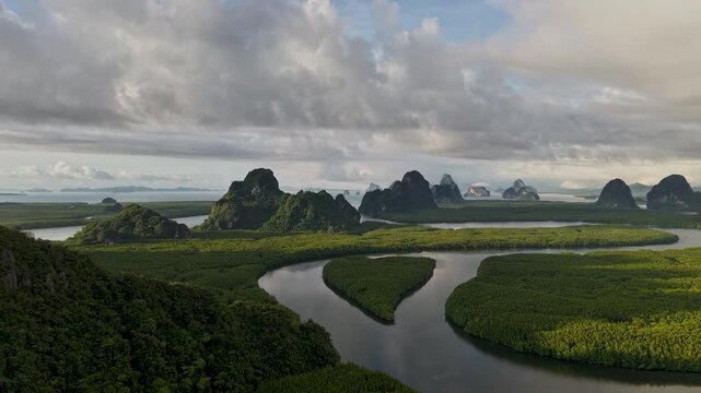 A captivating panoramic view of verdant islands and winding rivers unfolds under a dramatic sky, an ode to the grandeur of the natural world.
