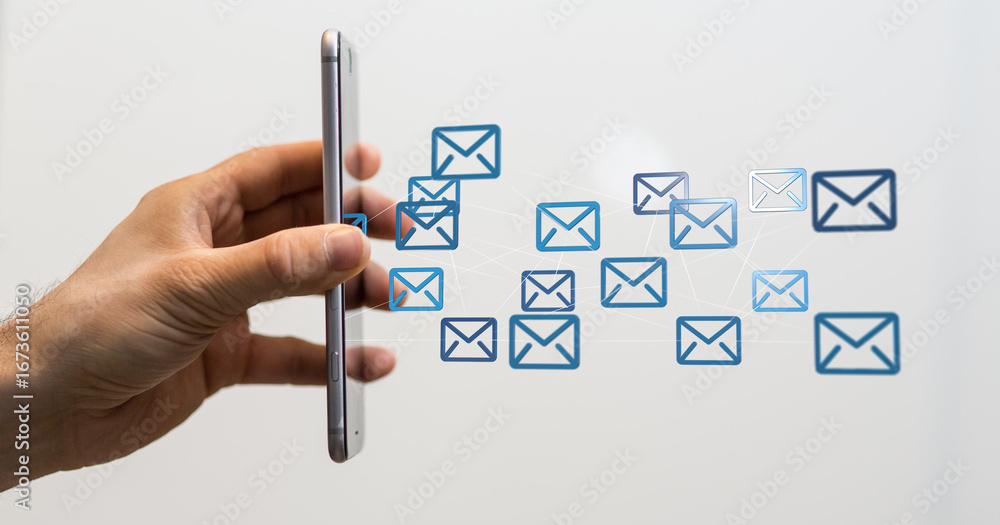 Poster stock photo of a hand holding a smartphone with email icons floating around it. perfect for communic