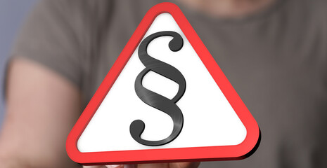 Stock photo of a person holding a red triangle warning sign with a paragraph symbol.  Perfect for...