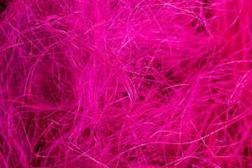 threads dyed pink for decorative work and creative work of artisans, closeup pink threads for creativity