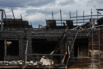 burned wooden building after arson
