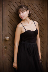 Fototapeta premium young woman in a black dress
