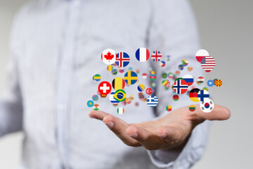 Image of hands holding many flags.  Perfect for global business, international communication, and...
