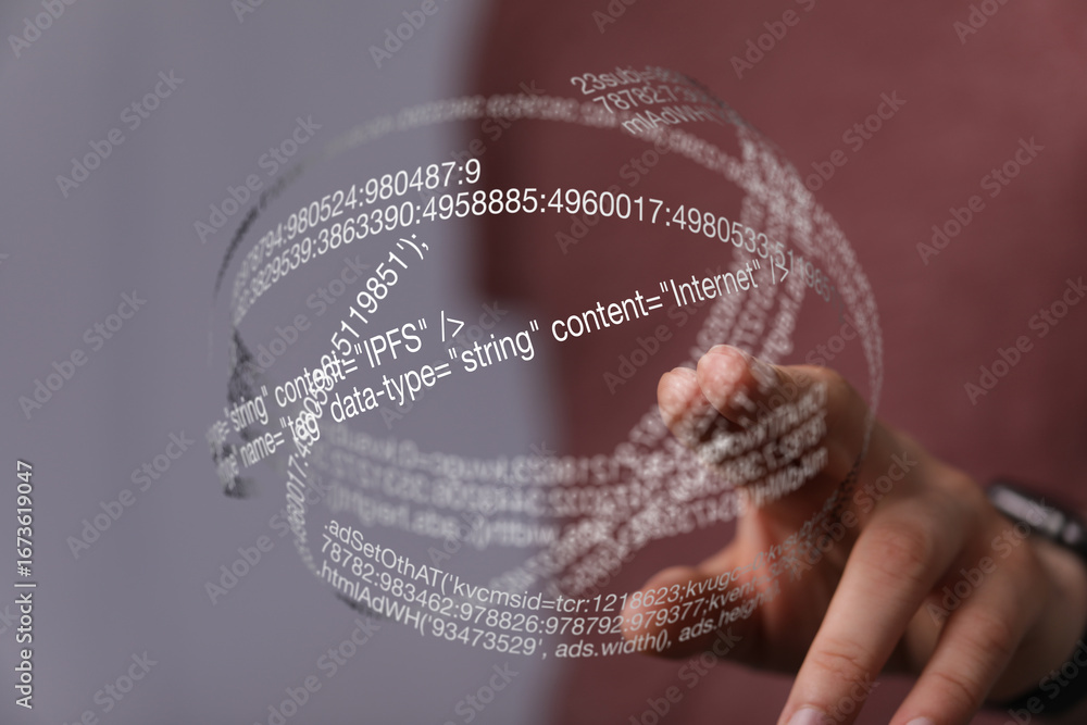 Poster person interacts with a futuristic holographic display showing lines of code, representing digital t
