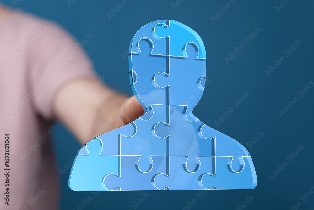 Poster abstract image of a person shaped from puzzle pieces. represents teamwork, collaboration, and unity.