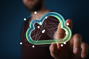 Person interacts with a digital cloud, symbolizing network technology and data.