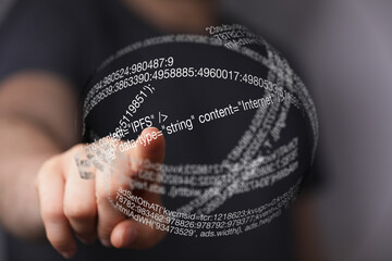 Abstract image of a person interacting with a sphere of code, representing digital technology and...