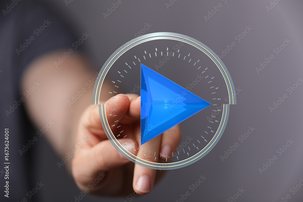 Poster person touching a futuristic play button interface. digital technology concept.