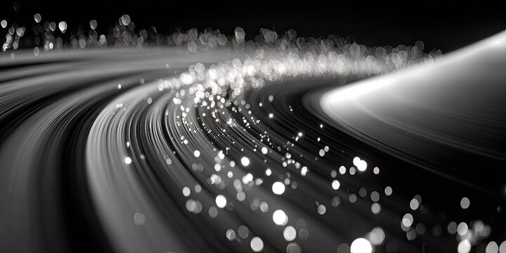 Abstract grayscale spiral with light streaks and bokeh