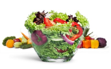 Tasty healthy fresh salad bowl with ingredients.