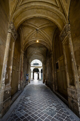 Arch of the old house. Old house with sculptural decorations.
