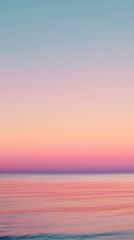 Fototapeta premium Pastel sunset over the ocean creating a serene and peaceful atmosphere