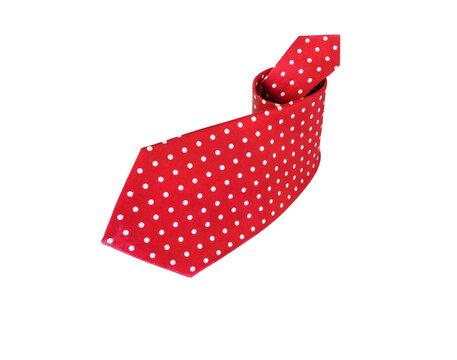 Rolled red silk polka dot necktie isolated on white background. - Powered by Adobe