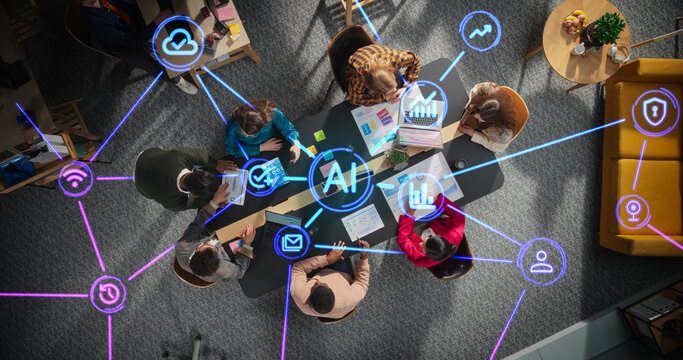 Diverse Team Collaborating with AI Tools in a Modern Office Meeting Room. Top Down View Highlighting Dynamic Interaction and Advanced Technology Integration with Holographic Interfaces