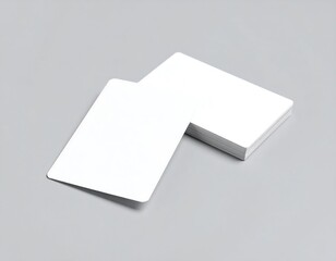 Blank business cards on a gray surface