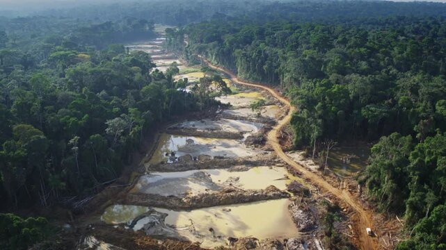 Congo &ndash; 4K Drone Aerial of Gold Mining Industry in Rainforest at Sunset