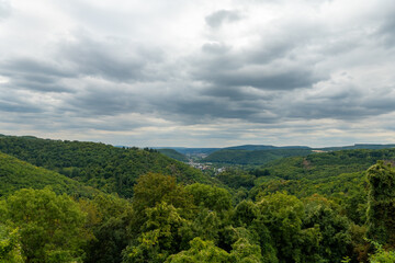 Breathtaking view of rolling hills and valleys under a cloudy sky in a serene nature landscape