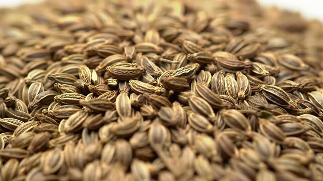 Detailed Macro View of Caraway Seeds Pile Displaying Rich Brown Tones Shallow Depth of Field and Sharp Texture for Culinary and Herbal Concepts Still Life in Selective Focus
