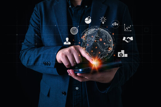 Global business technology concept with businessman using tablet and holographic world map, surrounded by finance, strategy, data, and innovation icons.