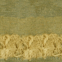 Seamless  Ripped green hipster jeans material. Destroyed denim Cloth texture. Close up.