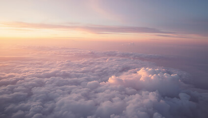 A breathtaking aerial view of a pastel cloudscape at sunset, with fluffy clouds in soft shades of pink, peach, lavender, and blue blending into a golden horizon. The dreamy sky creates a serene  