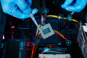 The technician is putting the CPU on the socket of the computer motherboard. electronic engineering...