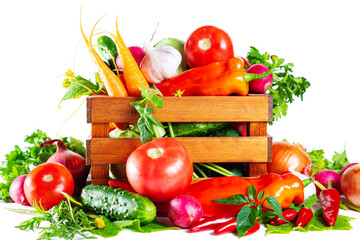 Fresh shiny different vegetables in a wooden crate. Isolated on white background.