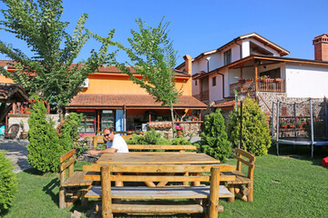 Man sitting at an outdoor table