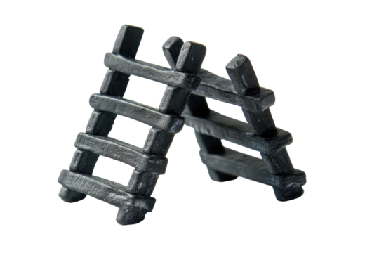 Miniature black ladders standing against a plain background, showcasing craftsmanship and design intricacy in a studio setting isolated on transparent background