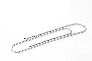 Paper clips on white background with text space
