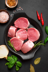 Raw uncooked pork tenderloin medallions