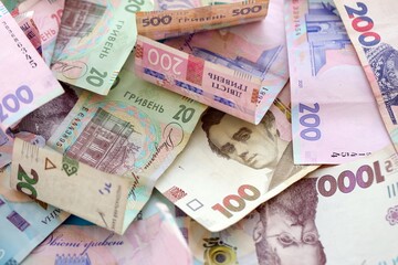 Big amount of different Ukrainian hryvnia money bills. Pile of crumpled ukrainian banknotes